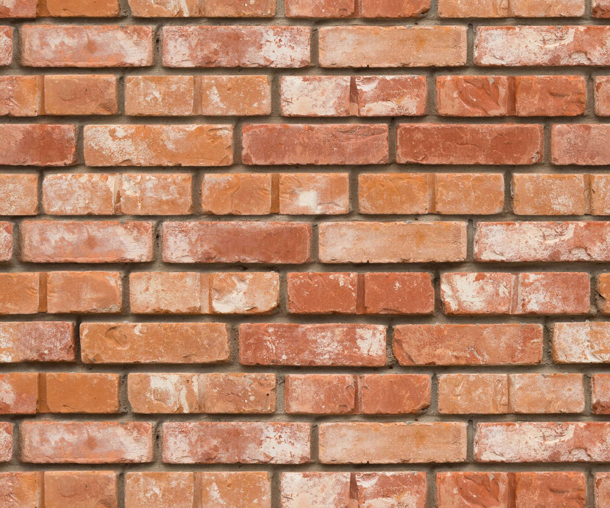 Pattern of red bricks wallpaper with a slight variation in colour