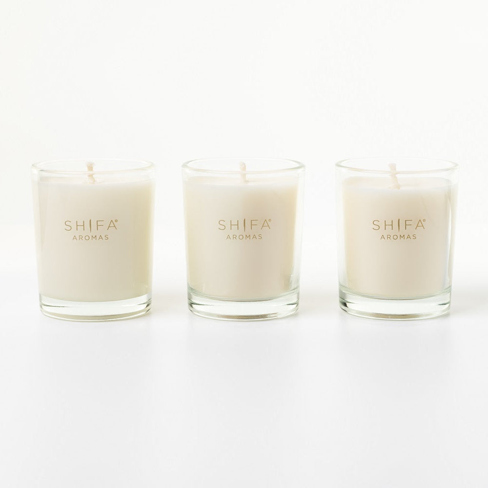 Three Shifra candles on a white background