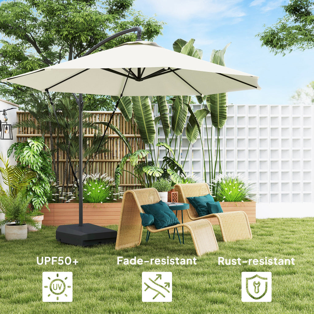 Beige patio umbrella with garden furniture and plants in the background