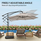 Beige patio umbrella with adjustable arm on a patio with chairs and flowers.