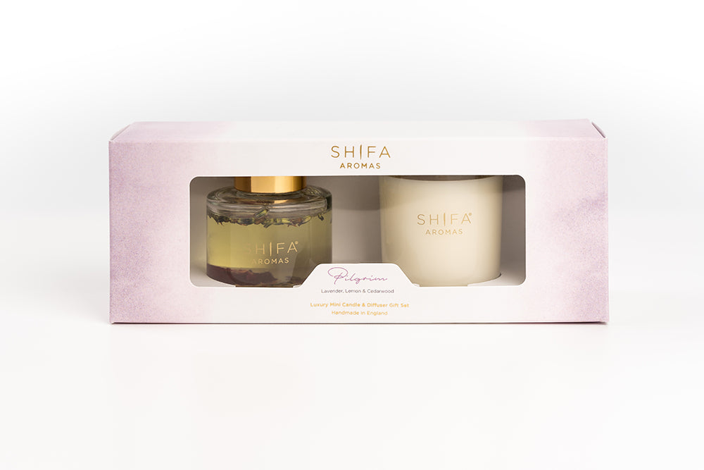 Shifa Aromas candle and diffuser set in a pink box on a white background