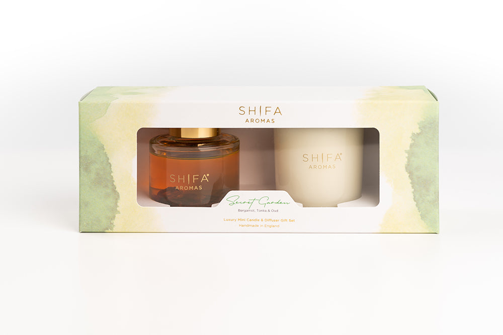 Shifa Aromas product set with a bottle and a candle in a decorative box on a white background