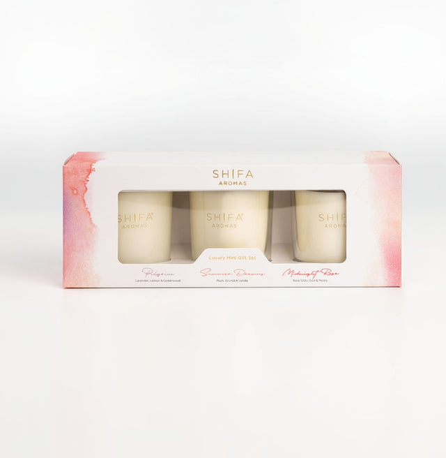 Set of three candles in a decorative box with 'SHEFA Aromas' branding on a white background.