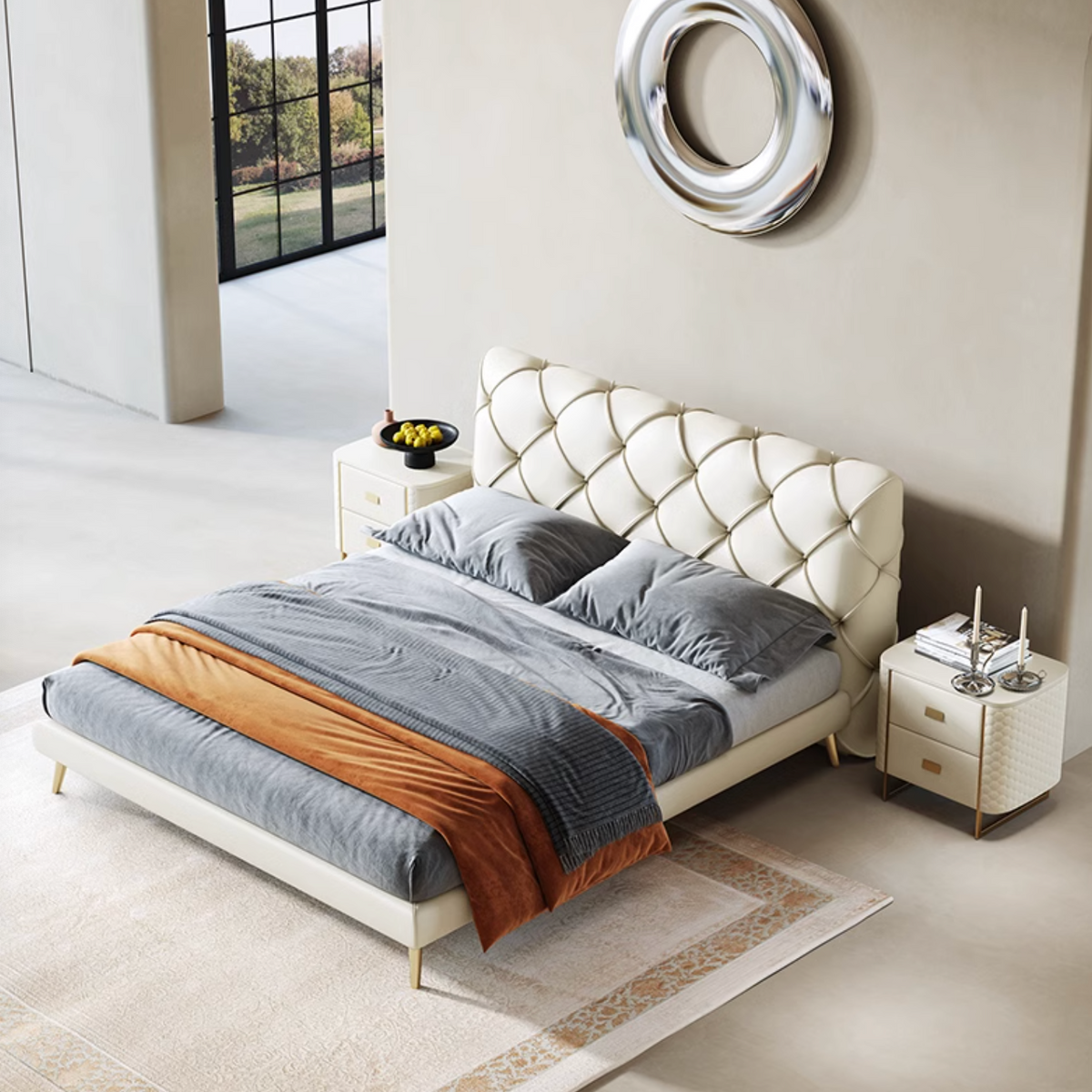 Modern bedroom with a tufted bed and decorative elements.