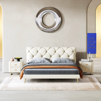 Modern bedroom with a tufted bed, nightstands, and decorative wall piece.