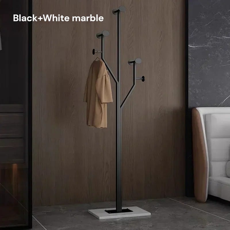 Black coat rack with a beige coat against a brown wall.