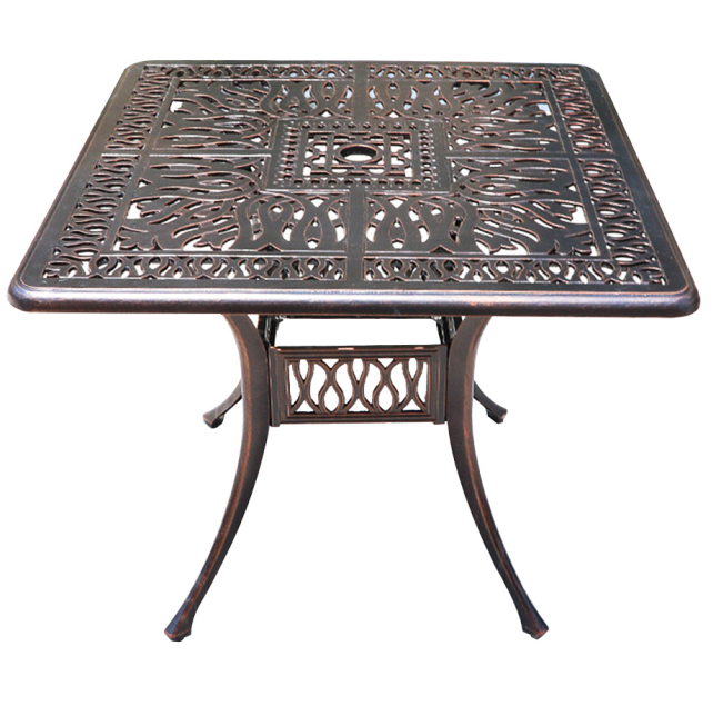 Decorative metal table with intricate patterns on a white background