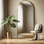 Modern interior with a large floor mirror, potted plant, and chair with a blanket.