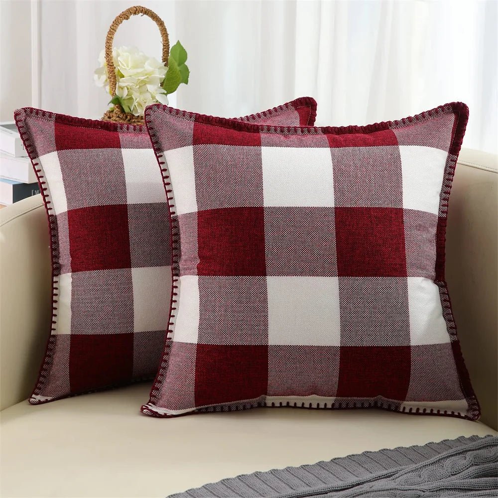 Two light gray velvet cushion covers with a solid pattern and visible texture, displayed on a neutral background.
