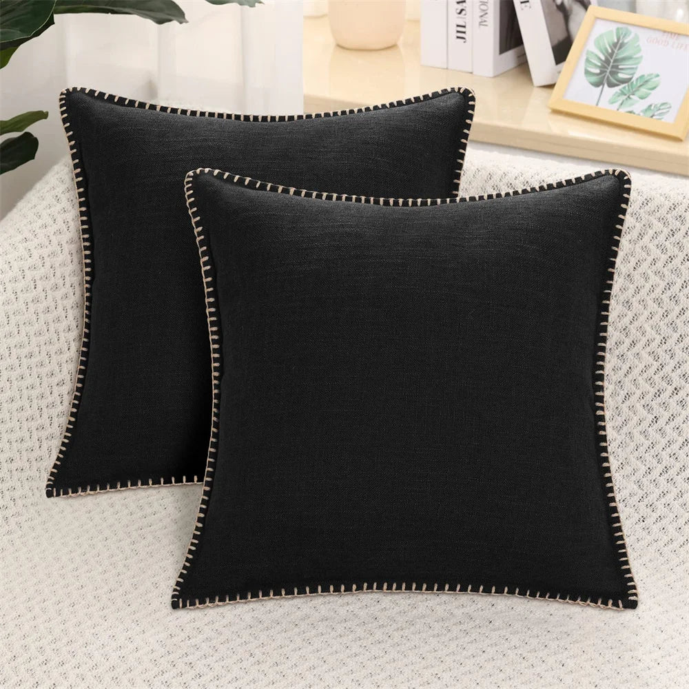 Two light gray velvet cushion covers with a solid pattern and visible texture, displayed on a neutral background.