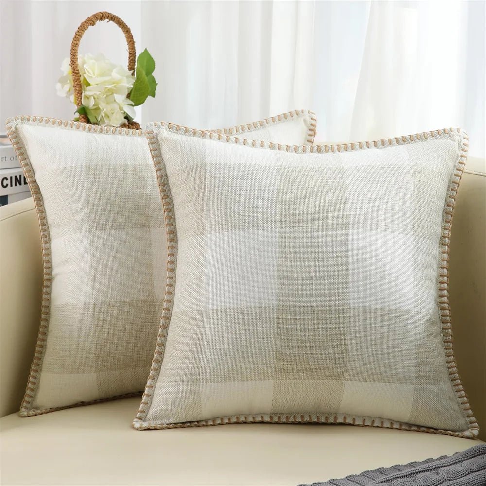 Two light gray velvet cushion covers with a solid pattern and visible texture, displayed on a neutral background.