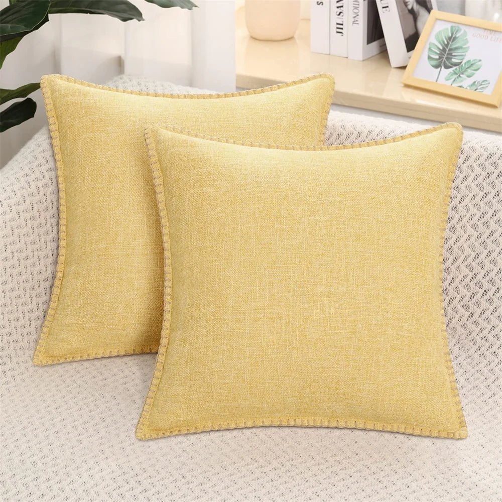 Two light gray velvet cushion covers with a solid pattern and visible texture, displayed on a neutral background.