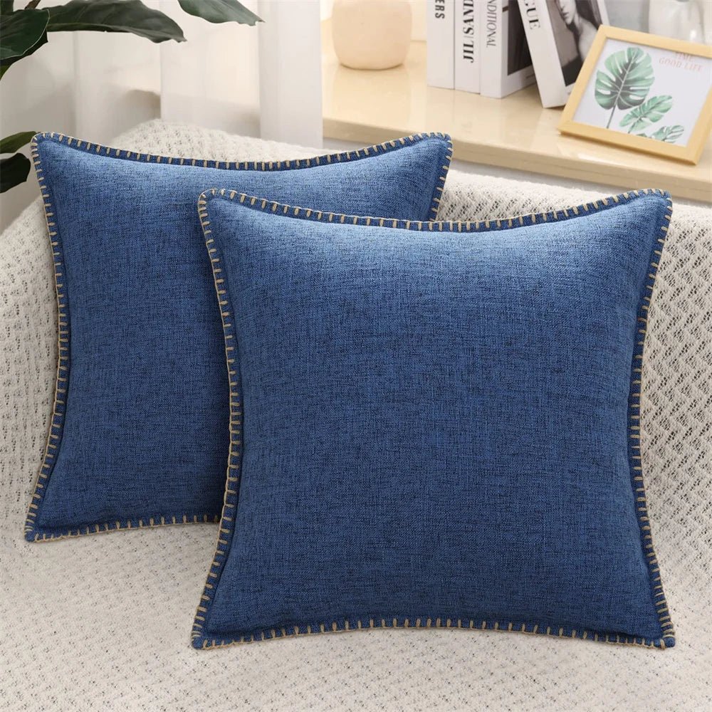 Two light gray velvet cushion covers with a solid pattern and visible texture, displayed on a neutral background.