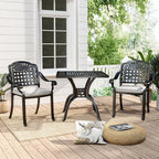 Outdoor patio set with table and chairs on a wooden deck.