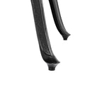 Close-up of a black metal rod with textured surface on a white background