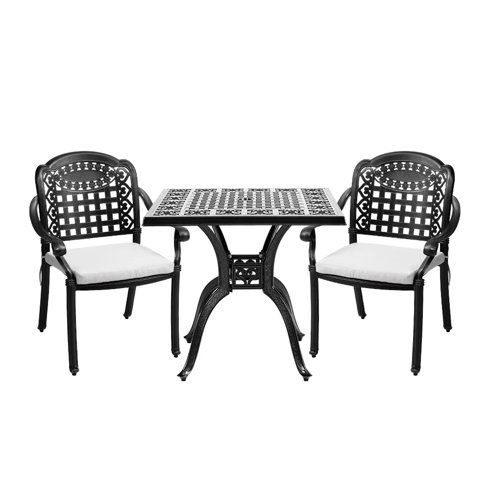 Black metal outdoor table with two matching chairs on a white background
