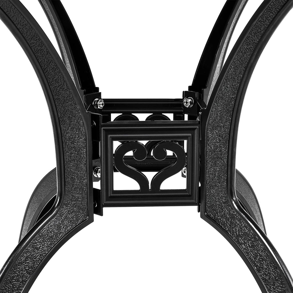 Close-up of a black metal chair frame with decorative heart design on a white background