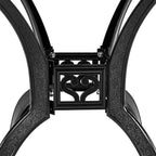 Close-up of a black metal chair frame with decorative heart design on a white background