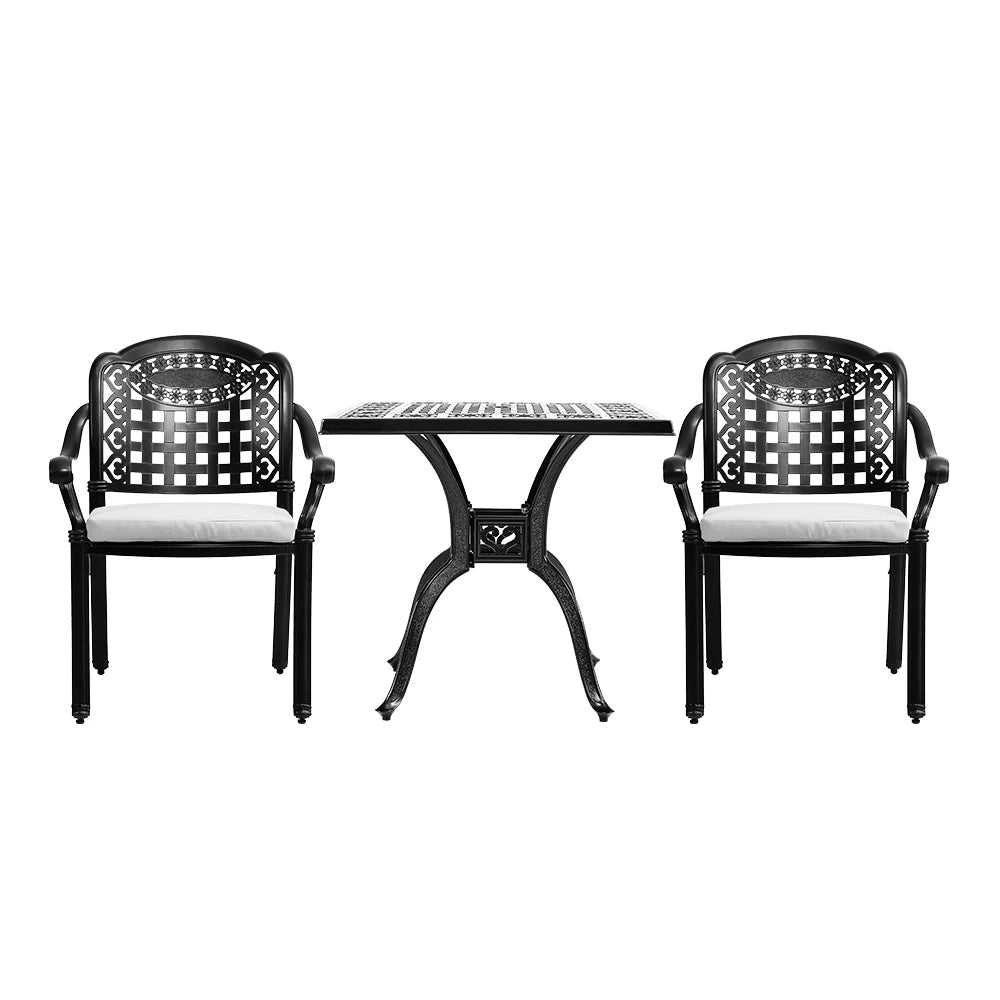 Black metal outdoor table and chairs set on a white background