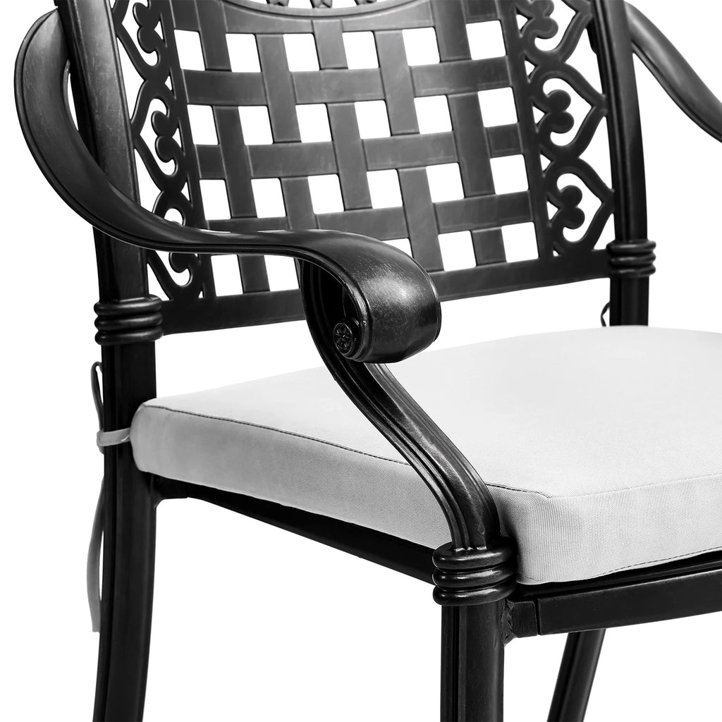 Black metal chair with white cushion on a white background