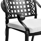 Black metal chair with white cushion on a white background