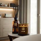 Candle and diffuser set with 'Li' branding on a surface.