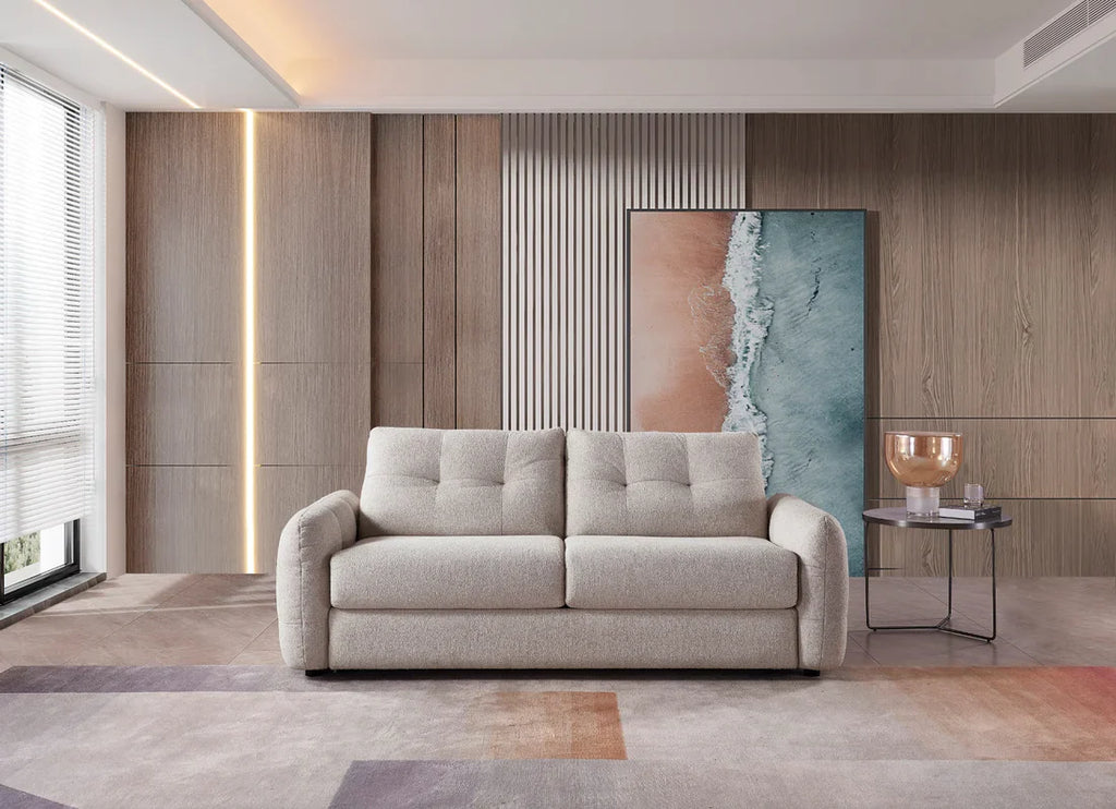 Modern living room with a gray sofa, wooden wall, and abstract artwork.