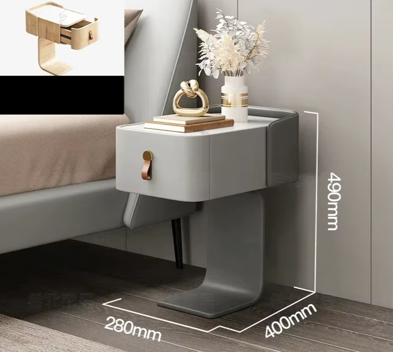 Gray nightstand with decorative items and measurements on a bedroom floor.