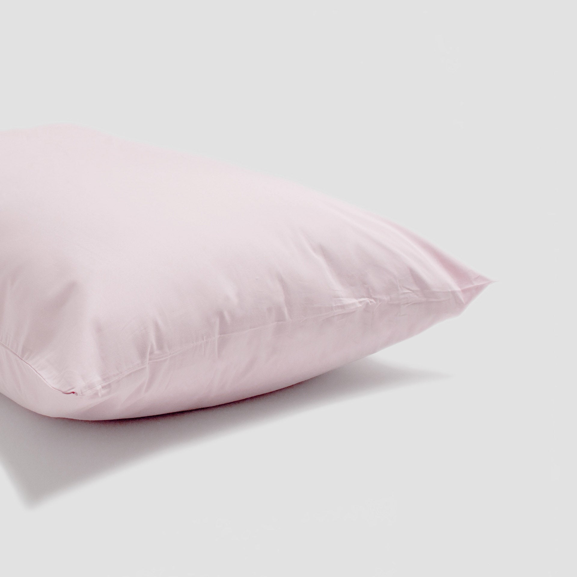 Pink pillow on a light gray background