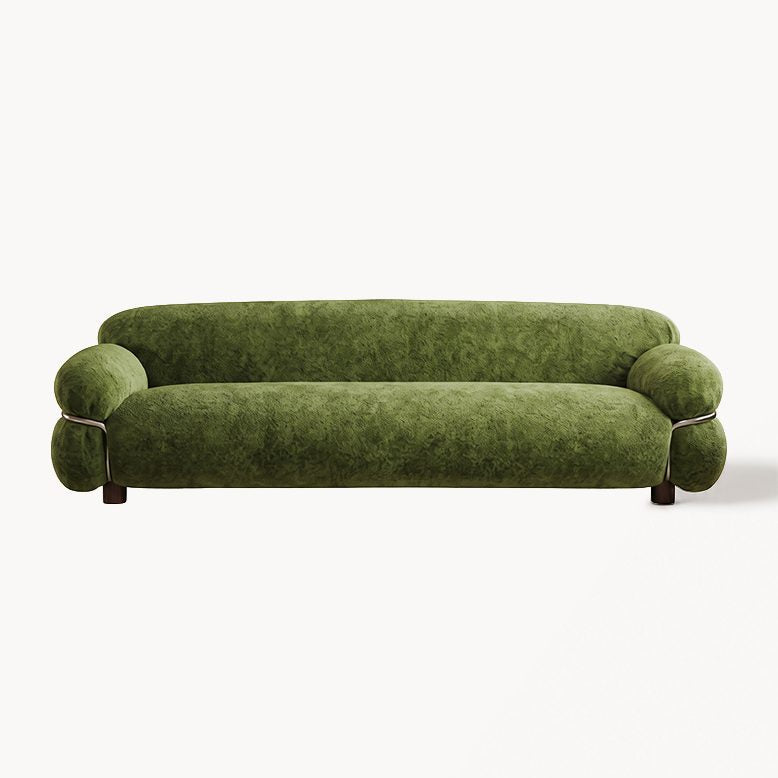 A modern low-profile sofa upholstered in textured olive green velvet, featuring rounded barrel arms and dark wooden legs, shown against a plain white background.
