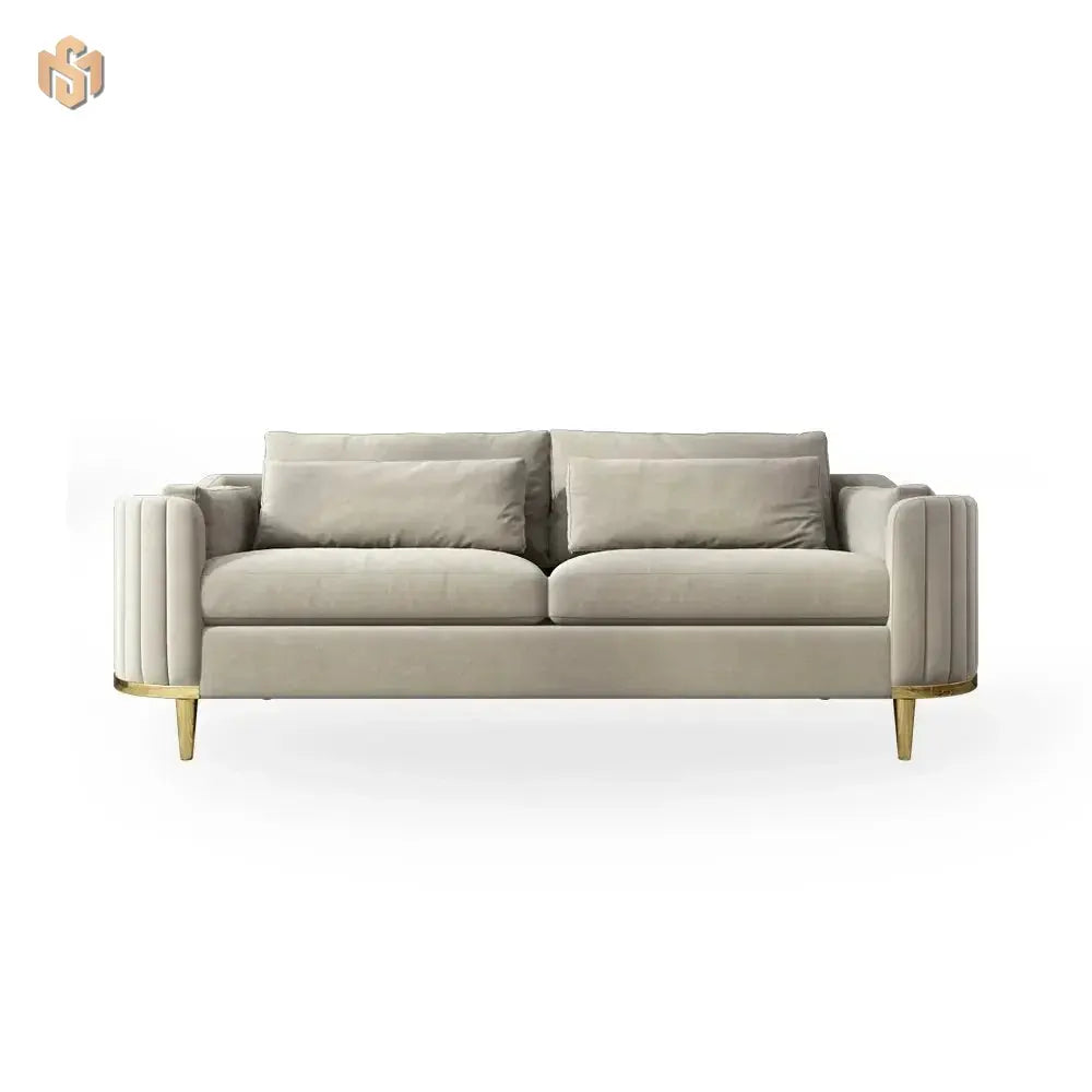 Beige sofa with gold legs on a white background