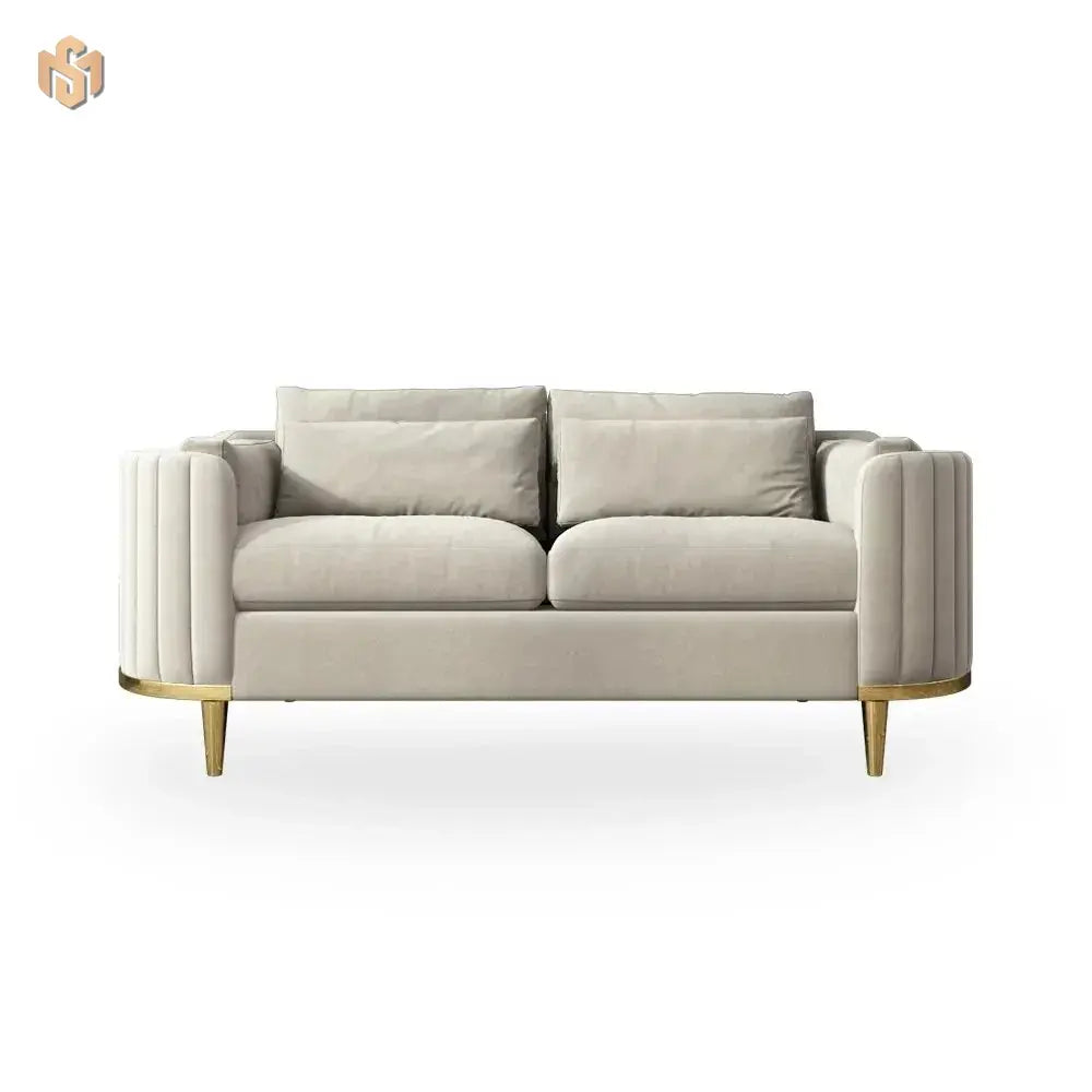 Beige sofa with gold legs on a white background