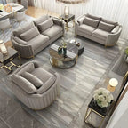 Modern living room with gray sofas, armchair, and coffee table on a marble floor.