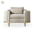 Beige armchair with gold legs on a white background