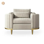 Beige armchair with gold legs on a white background