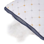 Quilt with geometric pattern and navy border on a white background