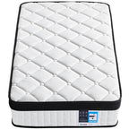 White quilted mattress with black border on a white background