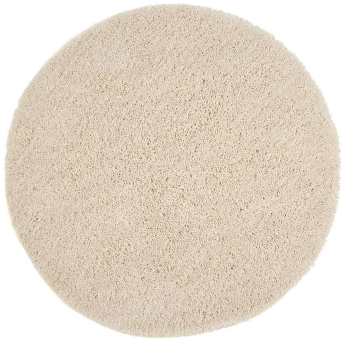 Round beige rug on a white background
