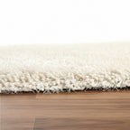 Close-up of a white rug on a wooden floor