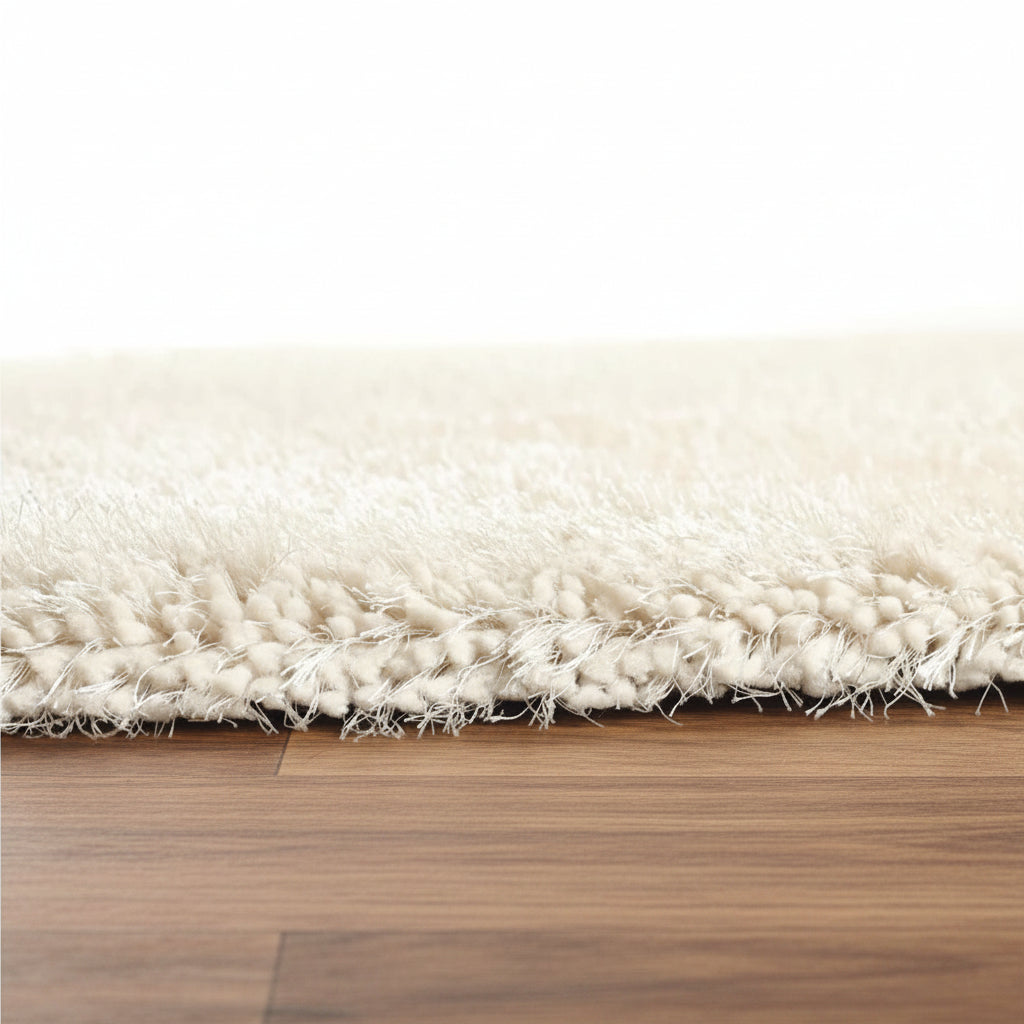 Close-up of a white rug on a wooden floor