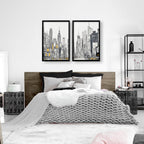 Modern bedroom with a bed, nightstands, and wall art of cityscapes.