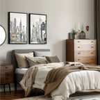 Neatly made bed with cityscape wall art and wooden furniture in a bedroom setting.