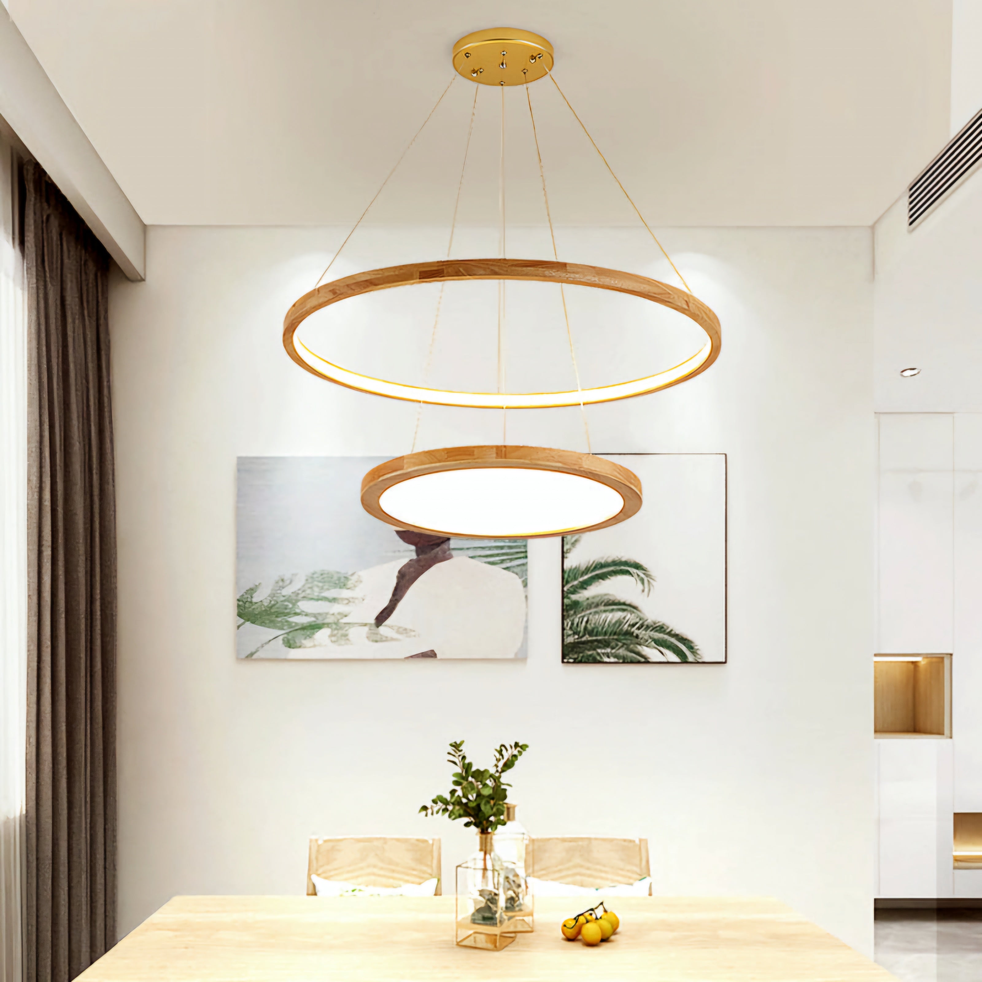 Modern pendant light fixture in a room with a table and decor