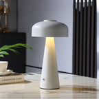 White table lamp on a marble surface with a blurred background