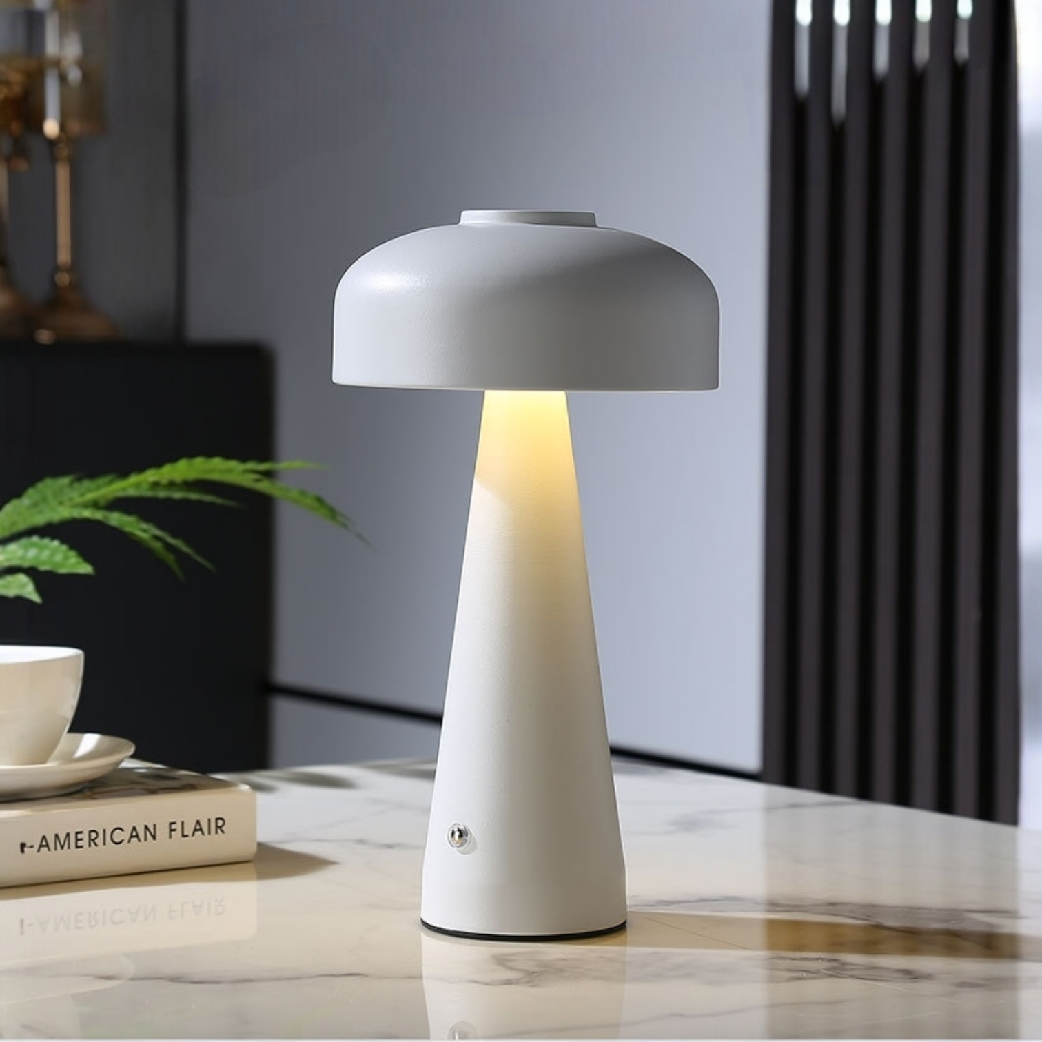 White table lamp on a marble surface with a blurred background