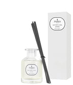 Parks diffuser bottle with black reeds and packaging on a white background