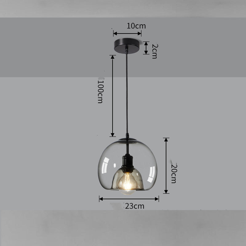 Pendant light with clear glass shade and black fixture, shown with measurements on a gray background.