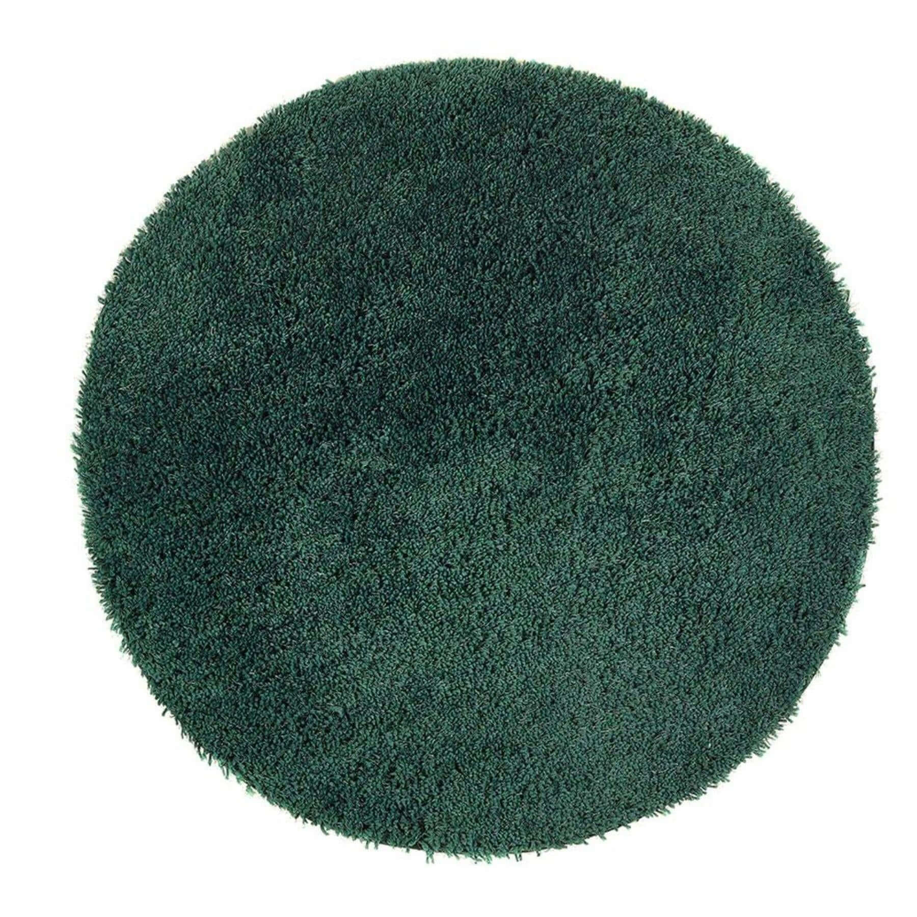 Green round rug on a white background