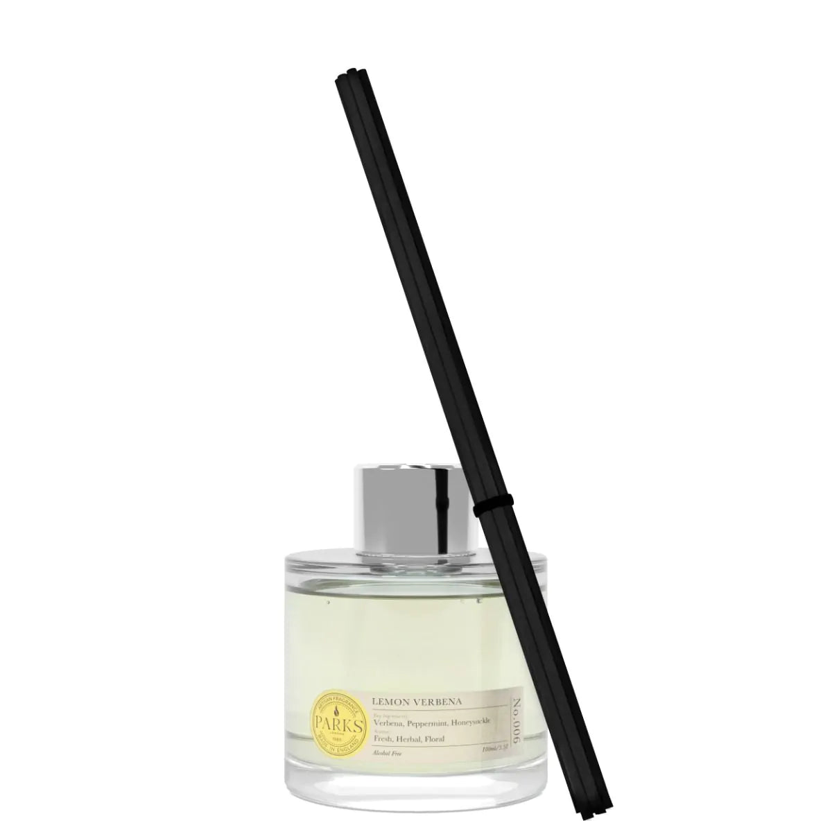 Glass diffuser bottle with black reed stick on a white background