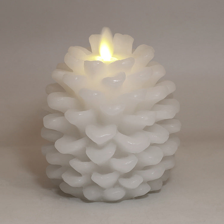 White textured candle with a lit center on a plain background